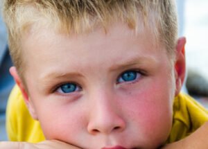 canva-close-up-photography-of-boy-with-blue-eyes-MADGyRQXbMU